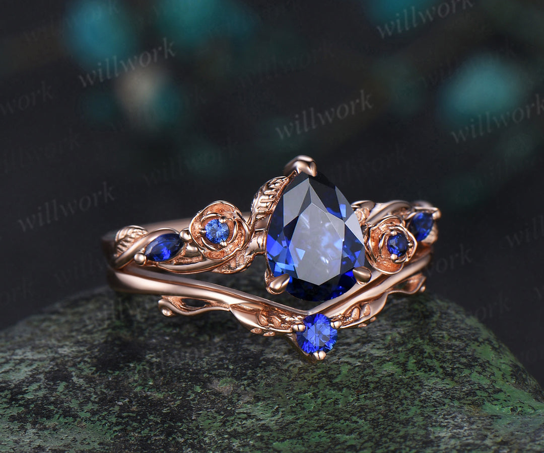 Pear shaped blue sapphire engagement ring set rose gold September birthstone leaf floral flower bridal ring set women