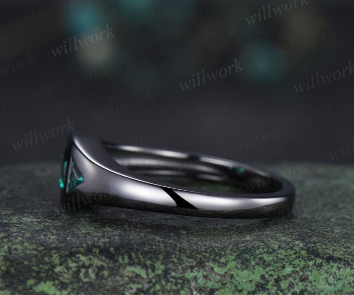 Hexagon cut emerald engagement ring black gold three stone flush setting with trillion emeralds modern ring