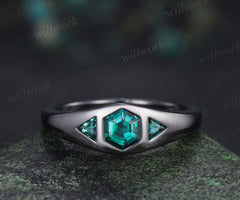 Hexagon cut emerald engagement ring black gold three stone flush setting with trillion emeralds modern ring