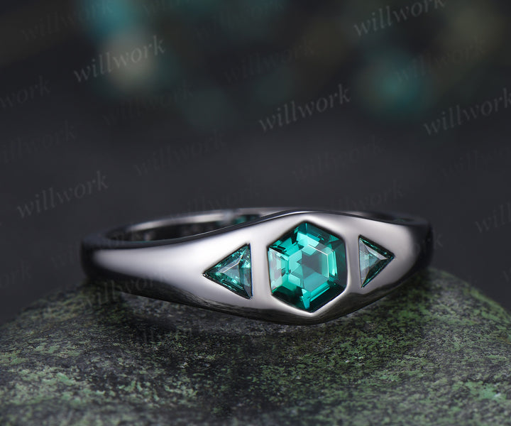 Hexagon cut emerald engagement ring black gold three stone flush setting with trillion emeralds modern ring