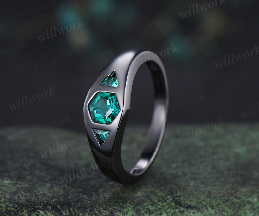 Hexagon cut emerald engagement ring black gold three stone flush setting with trillion emeralds modern ring