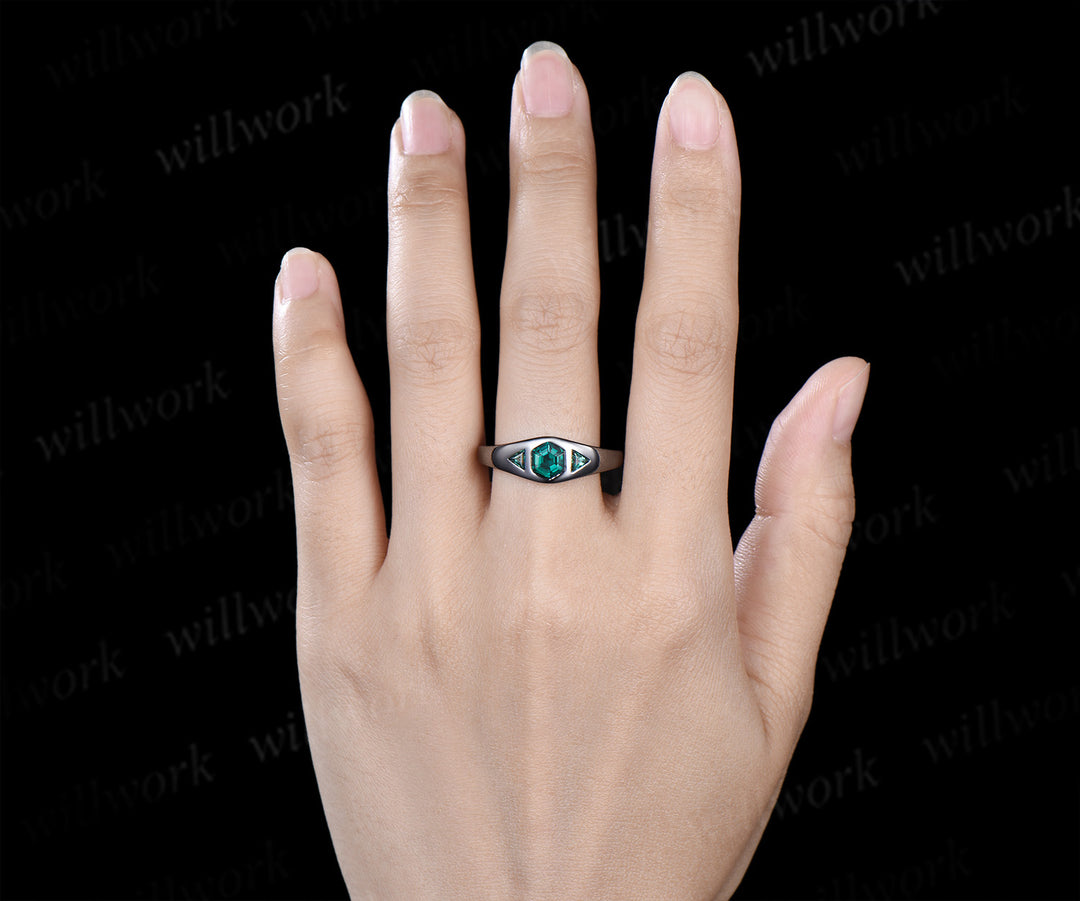 Hexagon cut emerald engagement ring black gold three stone flush setting with trillion emeralds modern ring