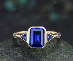 Emerald cut sapphire ring trilliant cut sapphire bezel engagement ring unique five stone ring for women