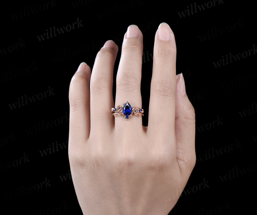 Pear shaped blue sapphire engagement ring set rose gold September birthstone leaf floral flower bridal ring set women
