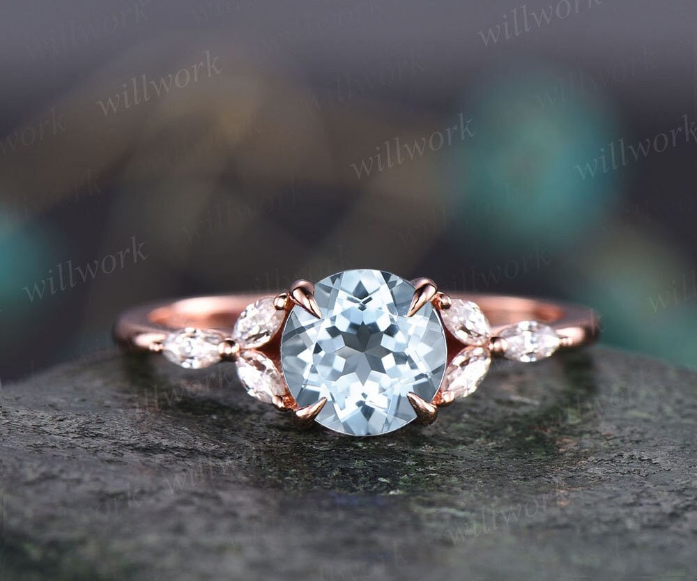 Wedding rings with aquamarine on sale stones