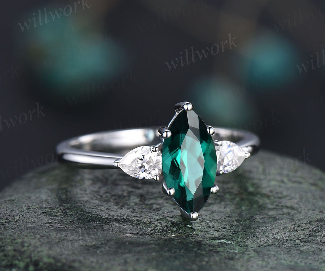 white gold emerald engagement ring