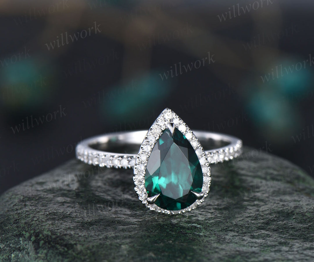 halo diamond emerald engagement ring