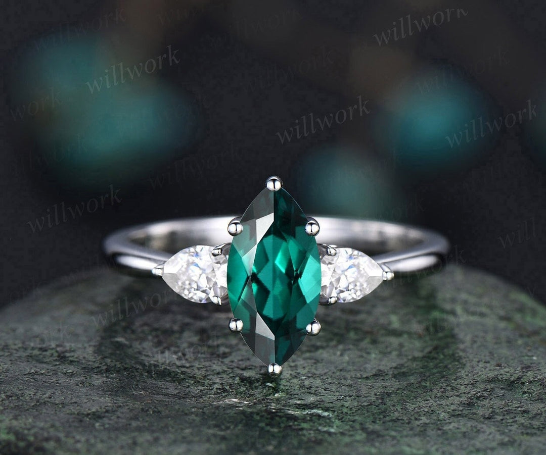 marquise cut emerald engagement ring